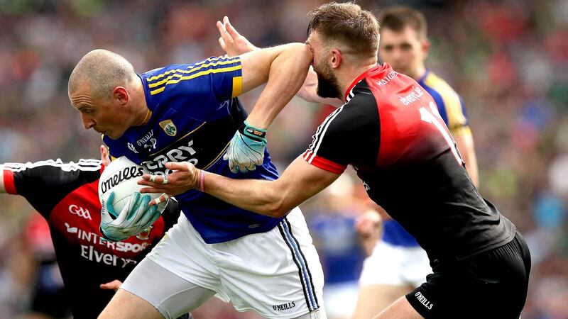 Kieran Donaghy catches Mayo’s Aidan O’Shea with an elbow as he bears down on goal at Croke Park. Photograph: Ryan Byrne/Inpho