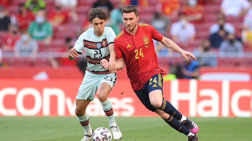 Joao Felix of Portugal challenges Aymeric Laporte of Spain during the international friendly match at Estadio Wanda Metropolitano in Madrid. Photograph: David Ramos/Getty Images