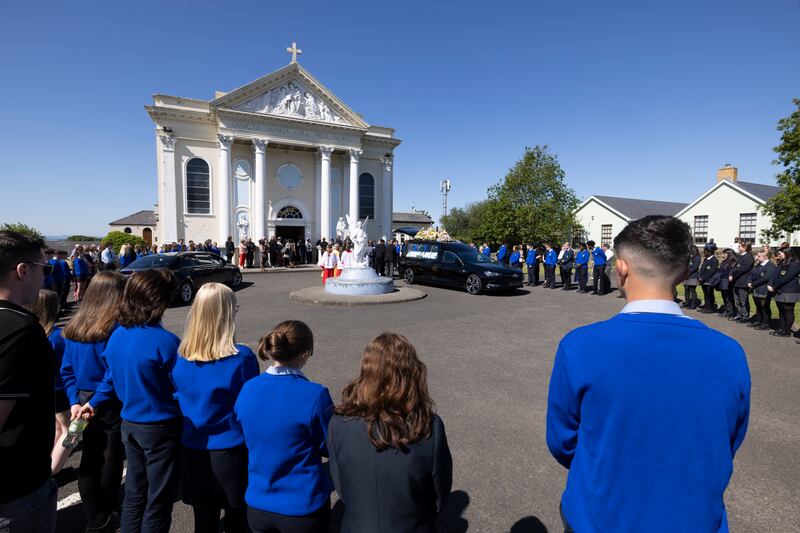 Students formed a guard of honour outside St Mary's Oratory in Buncrana, Co Donegal, for the funeral of teenager Emmanuel Familola on Saturday. Photograph: Joe Dunne