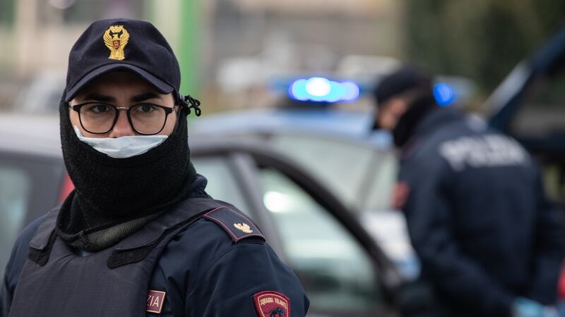 A police officer looks on at a checkpoint in Milan. The Italian Government has imposed a nationwide lockdown, limiting people to move only for work or health reasons, in an effort to fight the coronavirus outbreak. Photograph: Emanuele Cremaschi/Getty Images
