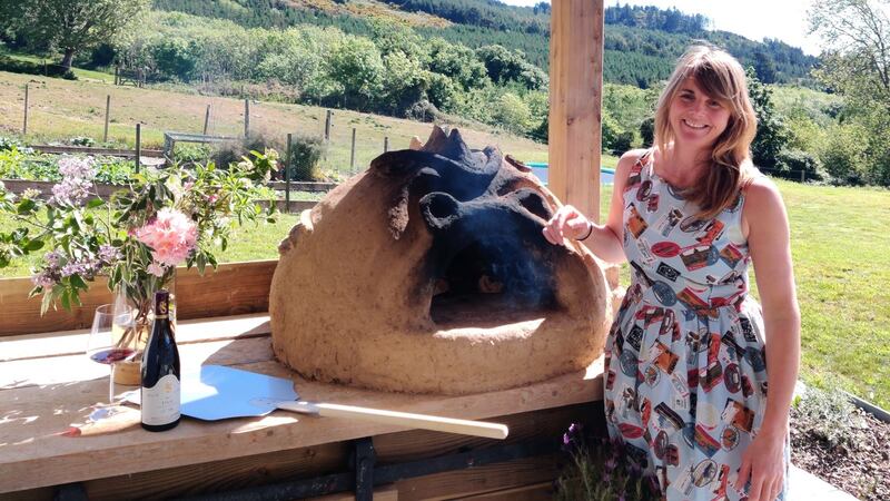 Harriet Tindal with her cob oven.