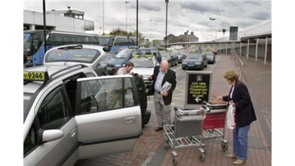 Taxis queuing at Dublin Airport: The National Taxi Driver's Union president has warned that drivers could picket the airport if Aer Rianta introduces a new charging structure without agreement between the parties.