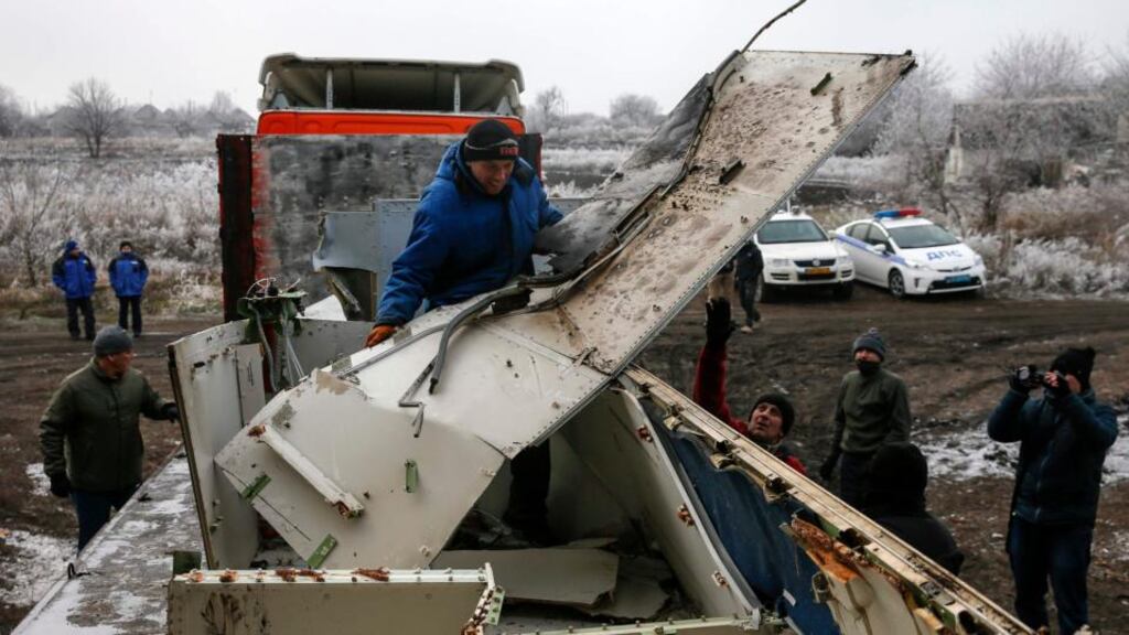 Workers transport wreckage from Malaysia Airlines flight MH17 at the site of the aircraft crash near the village of Hrabove in Donetsk, eastern Ukraine, earlier this month. Photograph: Maxim Shemetov/Reuters