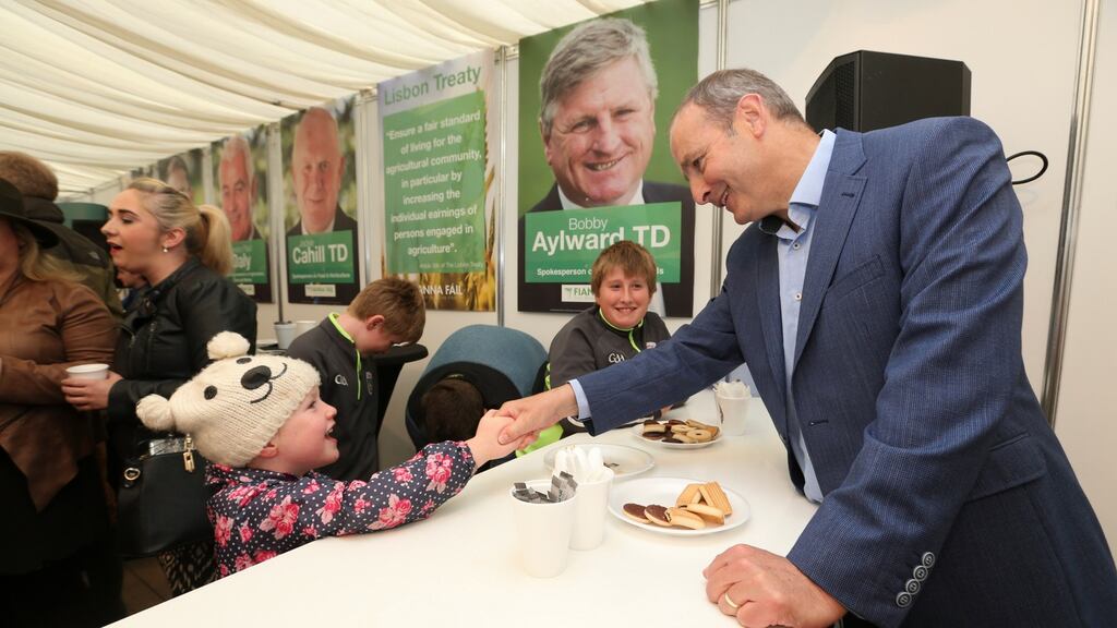 Fianna Fáil leader Micheál Martin TD with Molly Twomey (5) from Mucklagh, Co Offaly at the 2016 National Ploughing Championships, Screggan, Tullamore, Co Offaly. Photograph: Conor McCabe Photography