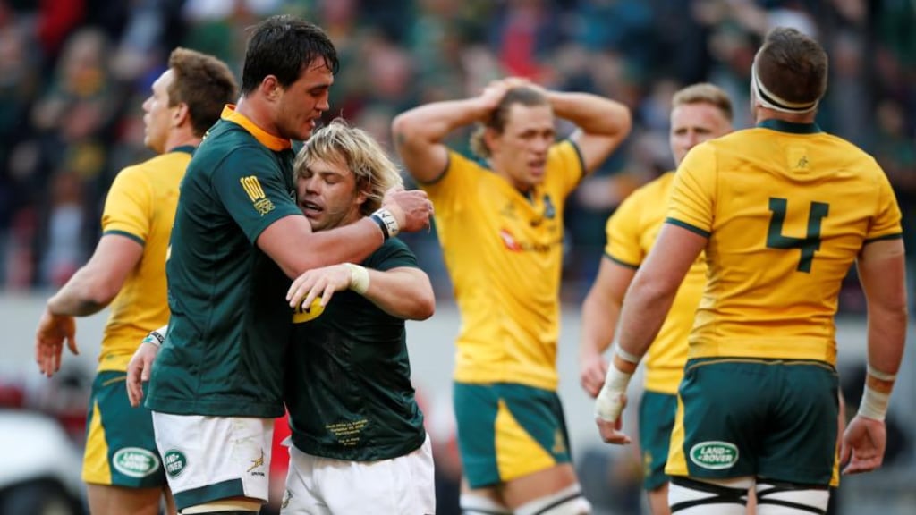 South Africa’s Faf de Klerk celebrates  scoring a try with team-mate Franco Mostert during the  Rugby Championship match at  Nelson Mandela Bay Stadium in  Port Elizabeth. Photograph: Siphiwe Sibeko/Reuters