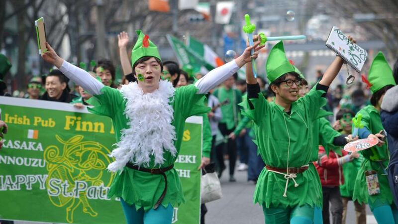 People wearing green march during a St Patrick’s Day parade in Tokyo, Japan. Photograph: Kazuhiro Nogikazuhiro/AFP/Getty Images