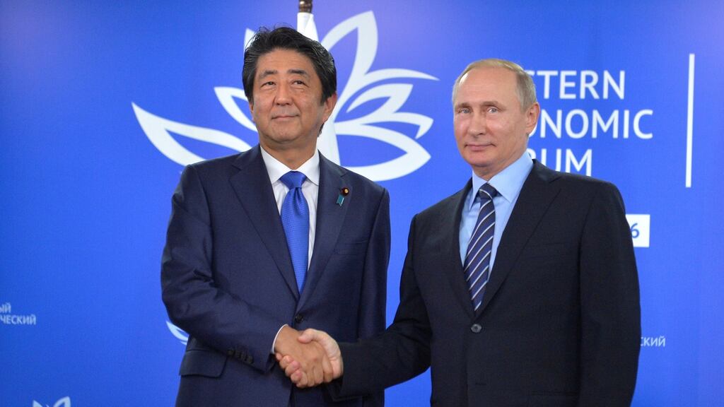 Russian president Vladimir Putin shakes hands with Japanese prime minister Shinzo Abe during a meeting on the sidelines of Eastern Economic Forum in Vladivostok, Russia. Photograph: Alexei Druzhinin/Sputnik