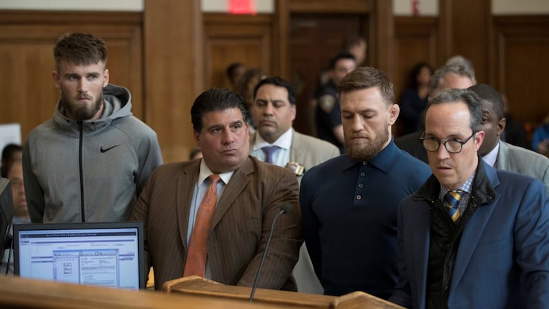 Mixed martial arts fighter Conor McGregor (2nd from right), and Cian Cowley (left), stand with lawyer Jim Walden (right), and John Arlia during their arraignment in a New York City courtroom on charges of assault. Photograph: Mary Altaffer/Reuters
