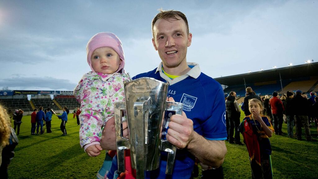 Thurles Sarsfields’ Lar Corbett celebrates with his daughter Faye and the Tipperary SHC trophy after victory at Semple Stadium. Photograph: Morgan Treacy/Inpho
