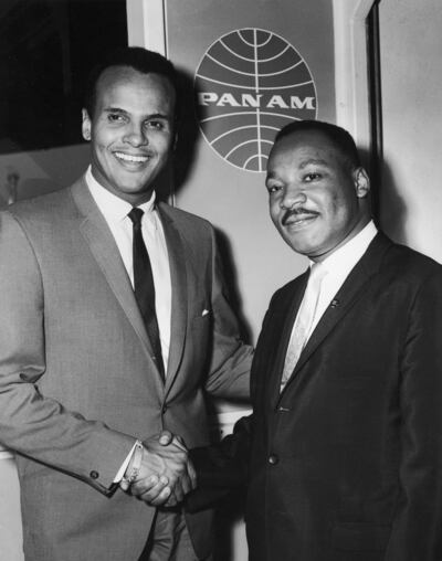 Belafonte shakes hands with Rev Martin Luther King Jr at Kennedy International Airport in August, 1964. Photograph: Hulton Archive/Getty