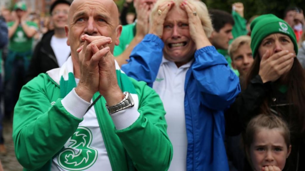 Fans watch nervously as their team prepare to take an early penalty in the match between the Republic of Ireland and France during the Euro 2016 match, in the fanzone at Smithfield Square in Dublin city centre. Photograph: Niall Carson/PA Wire