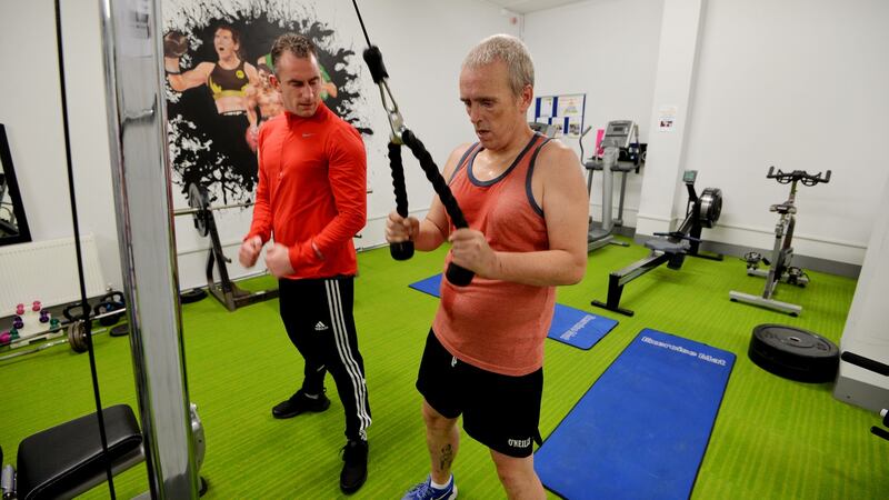 Staff member Johney Martin with Martin Reilly at the new gym. Photograph: Alan Betson
