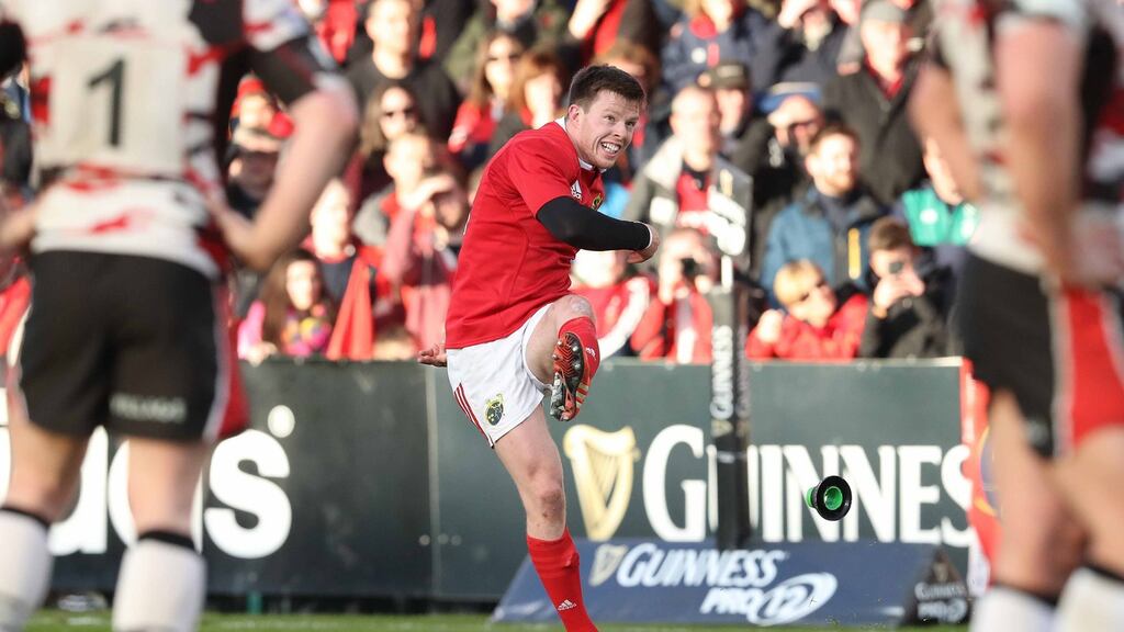 Munster’s Johnny Holland kicks a penalty against Edinburgh: “I was happy with my performance and it does give you the impetus to drive on.” Photograph: Billy Stickland/Inpho