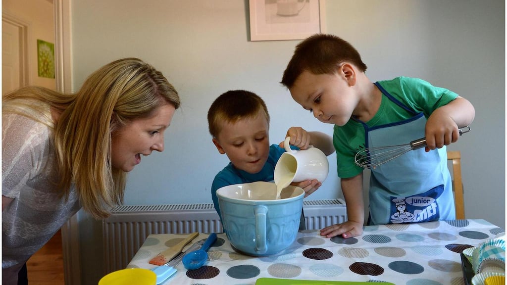 Sinead Fox with her children Ciaran age 4 and  Cathal age 2 cooking at their home in  Co Wexford. Photograph: Brenda Fitzsimons