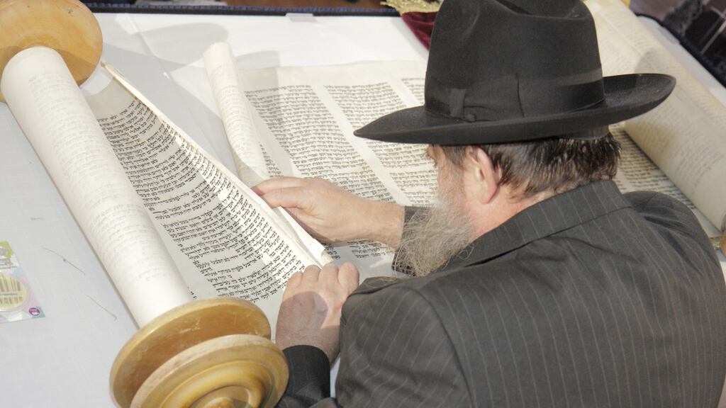 A man with a scroll at the Jewish Museum of Florida. Photograph: Jeffrey Greenberg/UIG via Getty Images