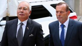 Malaysia PM visits search base for missing jet as sub joins hunt