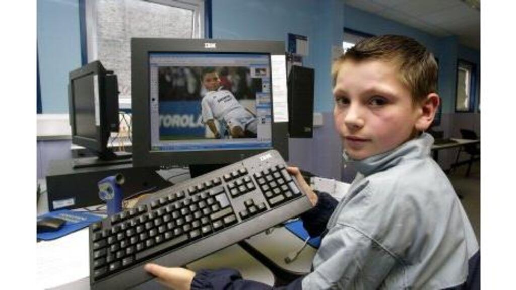 All his own work: Sean Doolin with a computer-generated image of himself as a soccer star in the Clubhouse at the Old Guinness Hop Store, Dublin.
