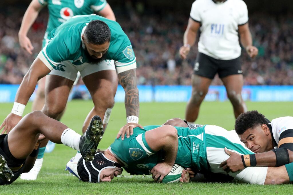 Ireland captain Caelan Doris dives over the line to score his side's first try during the victory over Fiji at the Aviva Stadium. Photograph: Paul Faith/AFP/Getty Images