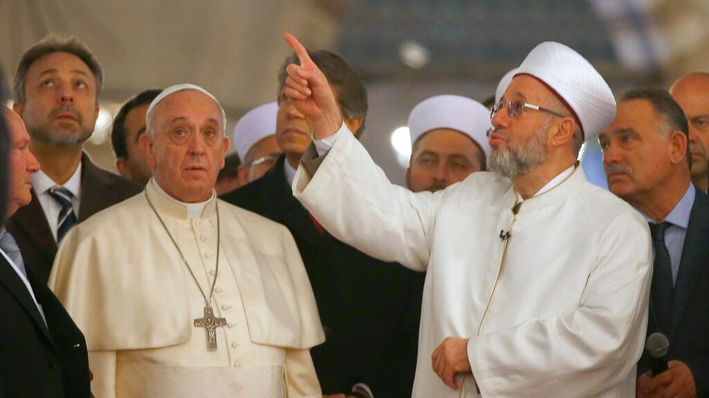 Pope Francis listens to Rahmi Yaran, Mufti of Istanbul during a visit to the Sultan Ahmet mosque, popularly known as the Blue Mosque, in Istanbul. Photograph: Tony Gentile/Reuters