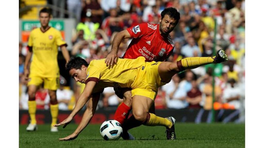 Liverpool's Javier Mascherano, seen here tackling Arsenal's samir Nasri, is the subject of a €15 million bid from Barcelona. - (Photograph: Clive Brunskill/Getty Images)