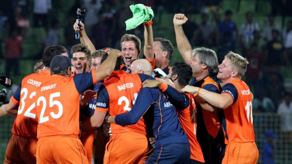 The Dutch players and backroom team celebrate after their stunning six-wicket victory over Ireland in Sylhet, Bangladesh that saw them qualify for the Super 10s stage of the World Twenty20. Photograph: Barry Chambers/Inpho