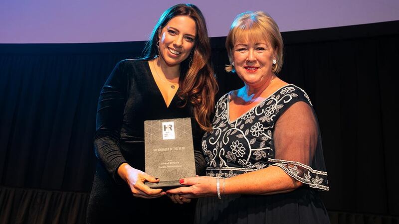 Brenda Dooley, Awards Head Judge, presents the HR Manager of the Year award to Sinead O’Toole, Dalata Hotel Group.