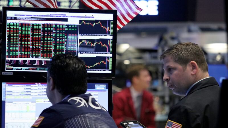 Traders work on the floor of the New York Stock Exchange. Photograph: EPA/ANDREW GOMBERT