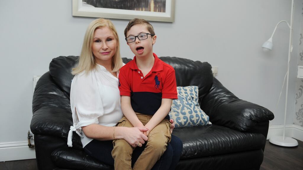 Sharon Saunders from Kingswood in Tallaght with her son Scott (9) who has Down syndrome and is on a reduced school timetable. Photograph: Aidan Crawley/The Irish Times