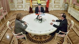 Merkel and Hollande in Moscow to discuss Ukraine peace plan