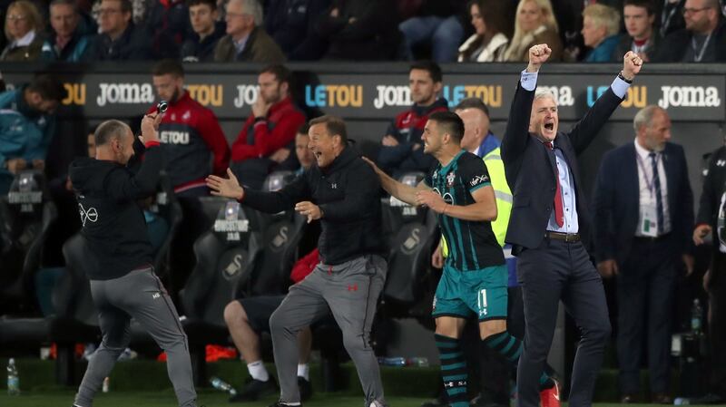 Mark Hughes celebrates Southampton’s 1-0 win over Swansea. Photograph: Nick Potts/PA