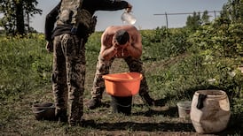 From the graveside to the front line, Ukrainians grimly endure mounting losses