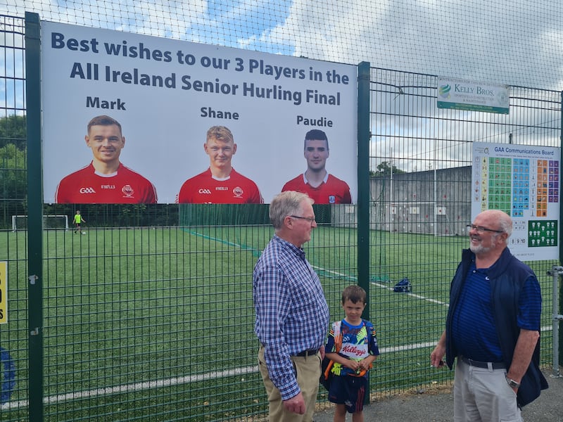 Blarney GAA stalwart Martin Lynch talking to fellow club man, Davy O'Brien and his grandson, Tadhg, about Cork's chances in Sunday's decider.