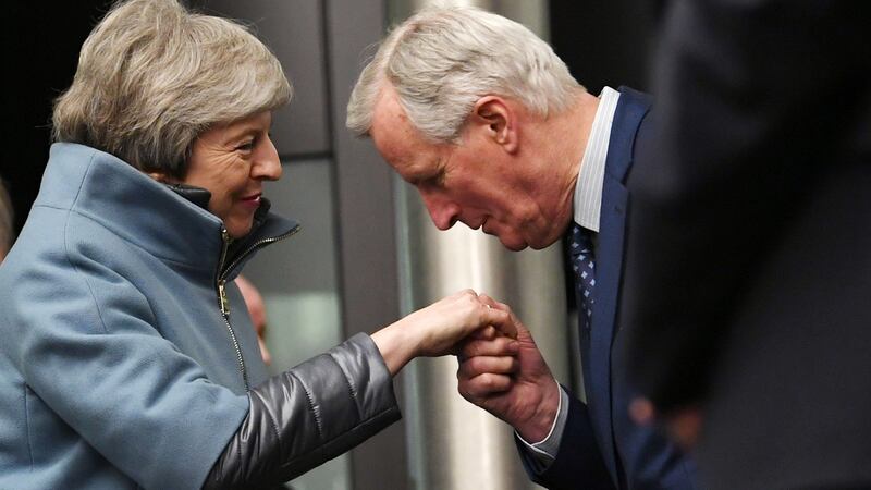 Chief European Union Brexit negotiator Michel Barnier kisses the hand British prime minister Theresa May as she arives at the European Parliament in Strasbourg on Monday night. Photograph: Patrick Seeger/EPA.