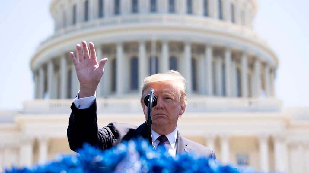 U.S. President Donald Trump gestures while speaking during the 38th annual National Peace Officers Memorial Day service at the U.S. Capitol in Washington, D.C., U.S., on Wednesday, May 15, 2019. Trump is poised to delay a decision by up to six months to impose auto tariffs to avoid blowing up negotiations with the EU and Japan and further antagonizing allies as he ramps up his trade war with China, according to people close to the discussions. Photographer: Kevin Dietsch/Pool via Bloomberg