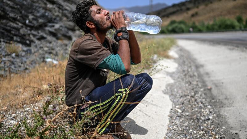 An Afghan migrant on a roadside on August 15th in Tatvan, on the western shores of Lake Van, eastern Turkey. Photograph: Ozan Kose/AFP via Getty Images