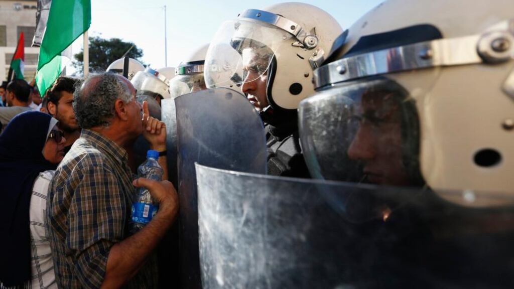 A Protester argues with Palestinian riot police during a protest against security coordination between Palestinian authority and Israel in the West Bank city of Ramallah today. Photograph: Mohamad Torokman/Reuters.