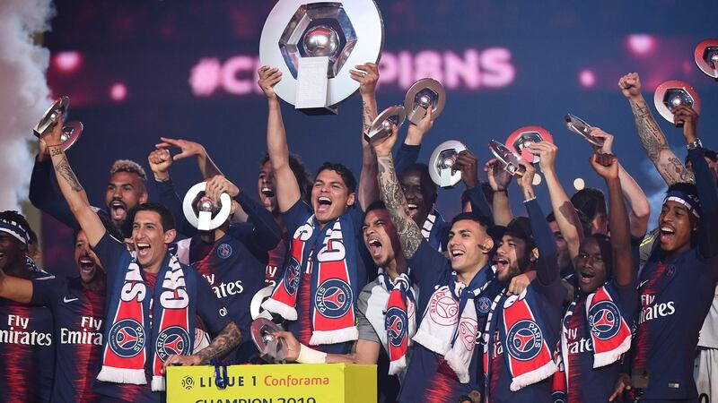 Paris Saint-Germain celebrate their Ligue 1 title victory. Photograph: Anne-Christine Poujoulat/AFP/Getty