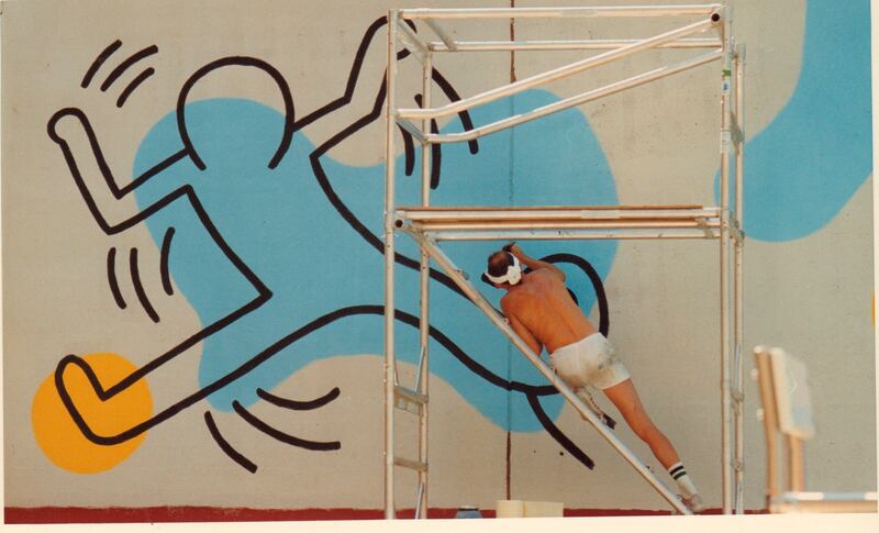 Keith Haring paints a mural on a 150ft wall at Clarkson St and Seventh Ave in Manhattan on August 20th, 1987. Photograph: Mark Hinjosa/Newsday RM via Getty
