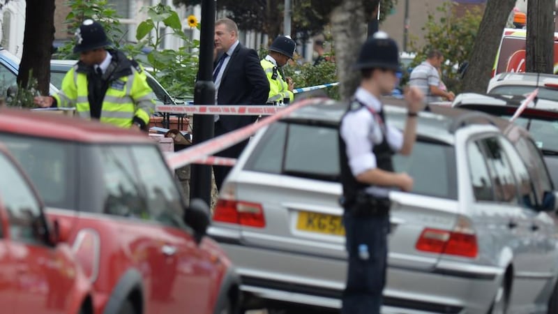 Police on Nightingale Road, Edmonton, north London where a woman has been beheaded in a back garden just after 1pm. Photograph: PA