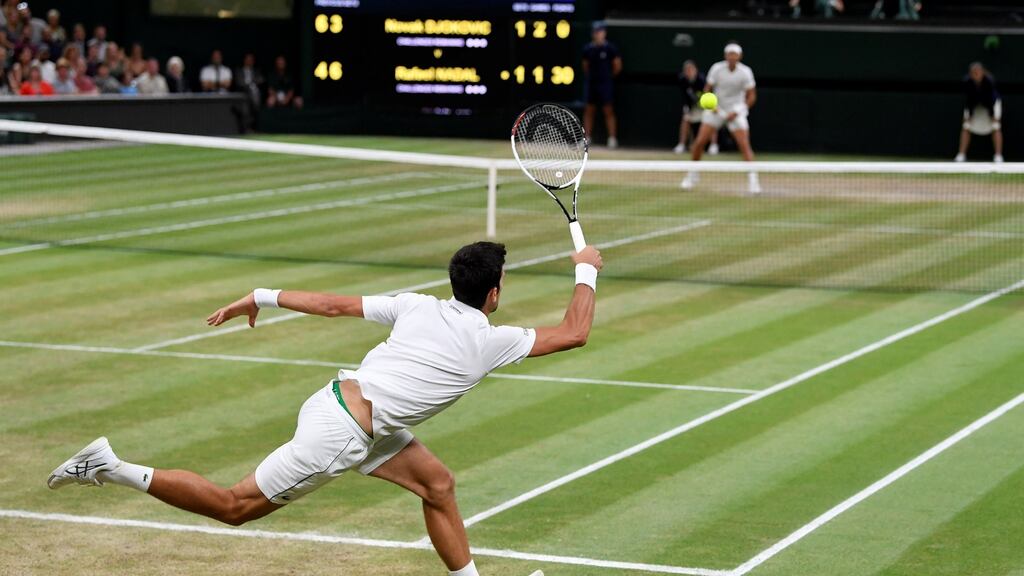 Novak Djokovic in action during his semi-final match against Rafael Nadal at Wimbledon. Photograph: Toby Melville/Reuters