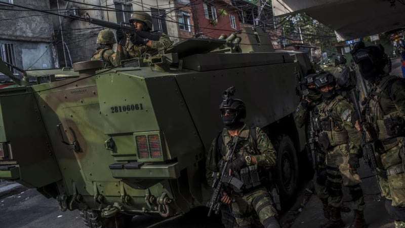 Gang war: soldiers patrol a favela in Rio that has been taken over by drug gangs. Photograph: Dado Galdieri/New York Times