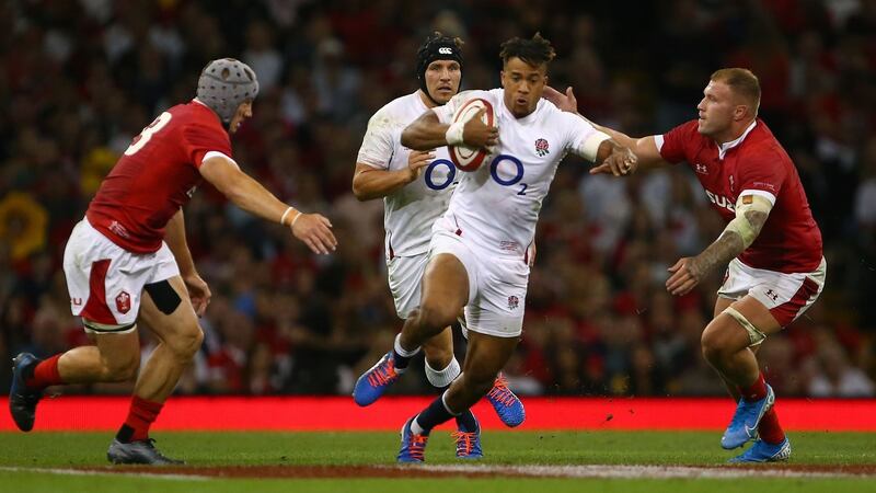 Jonathan Davies and Ross Moriarty try to collar Anthony Watson at the Millennium Stadium. Photograph: Geoff Caddick/AFP/Getty