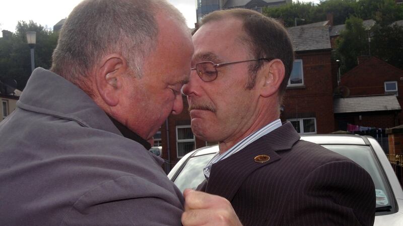 Joe Mahon (left) embraces Liam Wray, brother of Jim Wray, ahead of the publication of the Saville Report. Injured on Bloody Sunday, Joe lay beside Jim and saw a soldier shoot him in the back a second, fatal, time. Photograph: Courtesy of Derry Journal