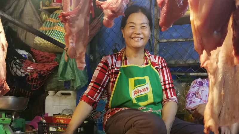 A woman sells meat at a market in Phnom Penh. Photograph: Nevenka Lukin