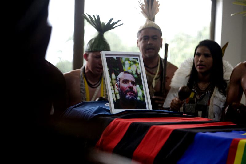 Xukuru´s indigenous people sing a sacred pray in honour of the Brazilian indigenous expert Bruno Pereira next to his coffin during his funeral in 2022. Photograph: Brenda Alcantara/AFP/Getty