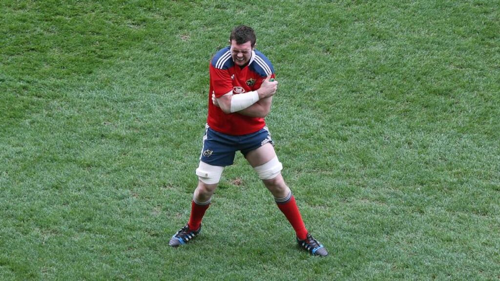 Peter O’Mahony holds his injured left shoulder at Thomond Park. Photograph: Cathal Noonan/Inpho