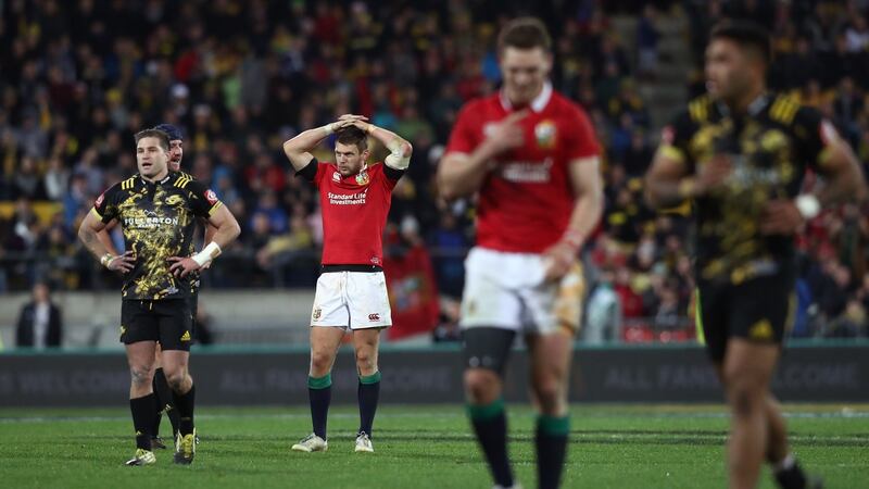 Lions players stand dejected at the end of the game. Photo: David Rogers/Getty Images