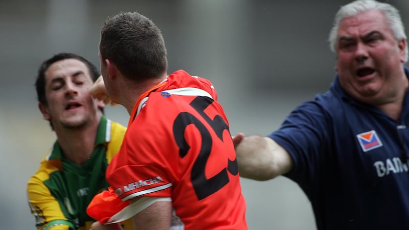 Kerry’s Paul Galvin tangles with Armagh maor foirne John Toal as manager Joe Kernan tries to intervene during the 2006 championship. Both players received red cards which hurt Kerry more than Armagh. Photograph:  Lorraine O’Sullivan/Inpho