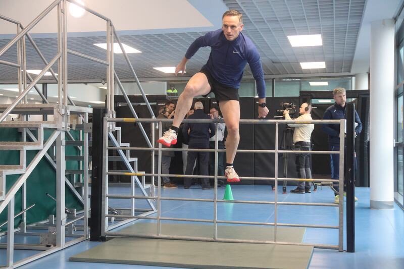 Sgt Seán Óg Mac Seoin shows how it is done during the obstacle course which is part of the Garda fitness test. Photograph: Ronan McGreevy