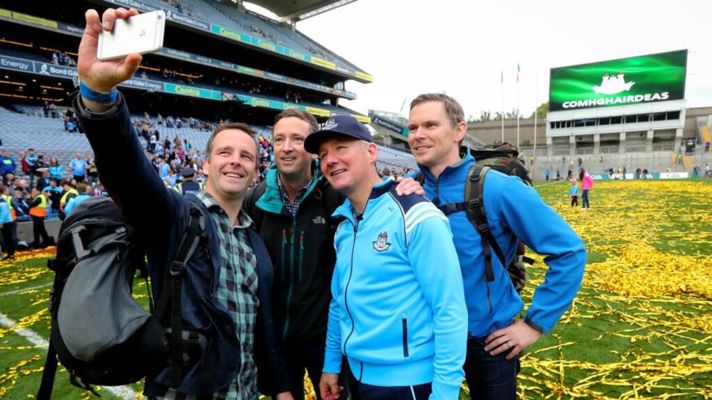 Dublin manager Jim Gavin has a selfie taken with members of the Air Corps who flew over Croke Park before the game, including Capt Sean McCarthy, Cmdt Frank Byrne and Capt Enda Walsh. Photograph: Ryan Byrne/Inpho